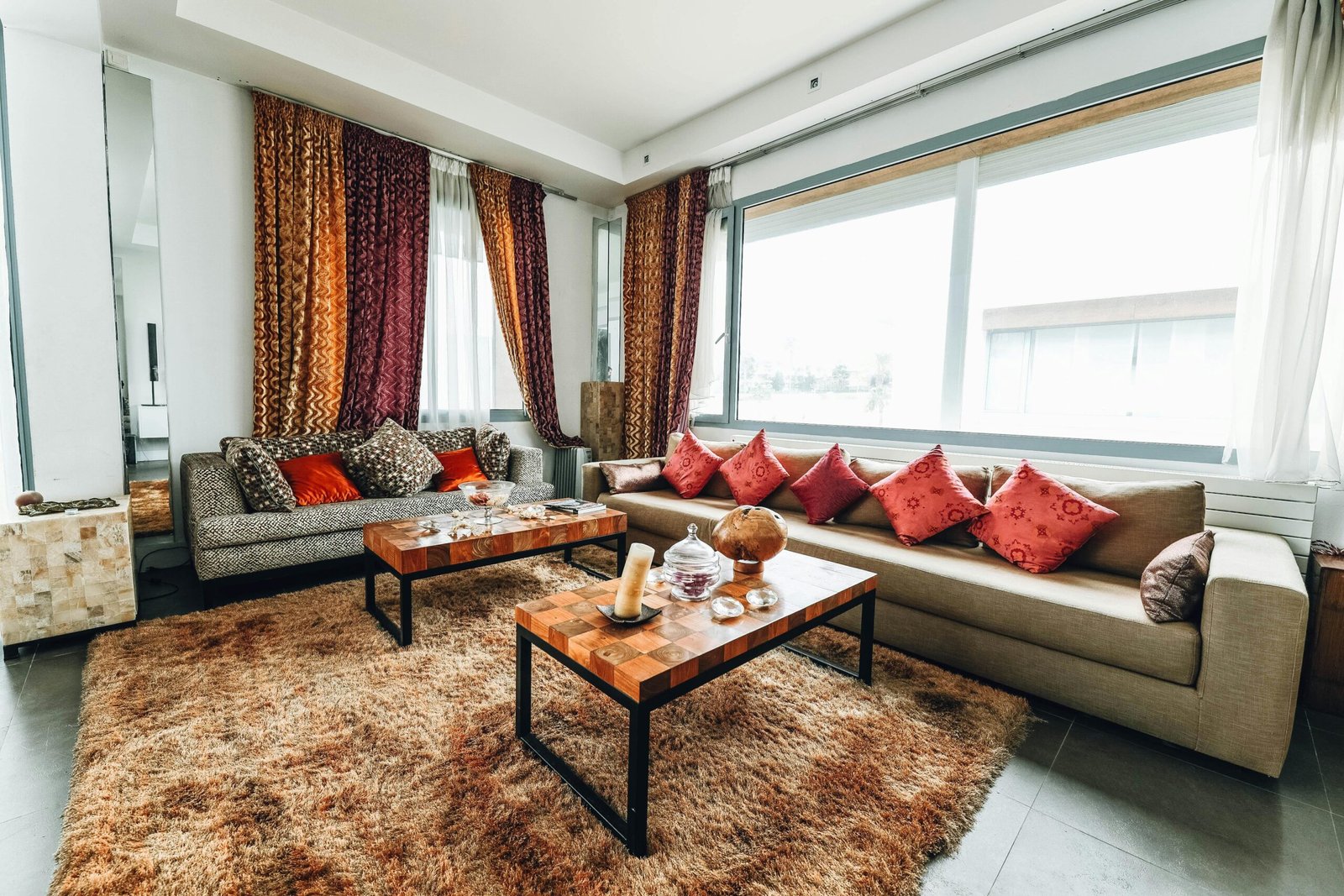 Stylish living room with contemporary furniture, colorful curtains, and cozy atmosphere, perfect for modern home interiors.